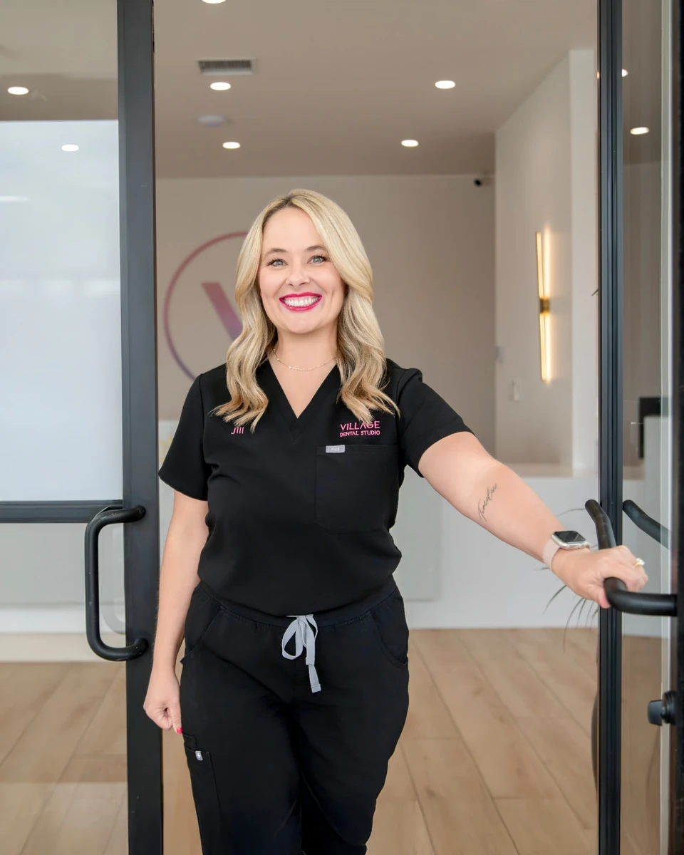 Jill, Village Dental Studio office manager, welcoming patients at the front door