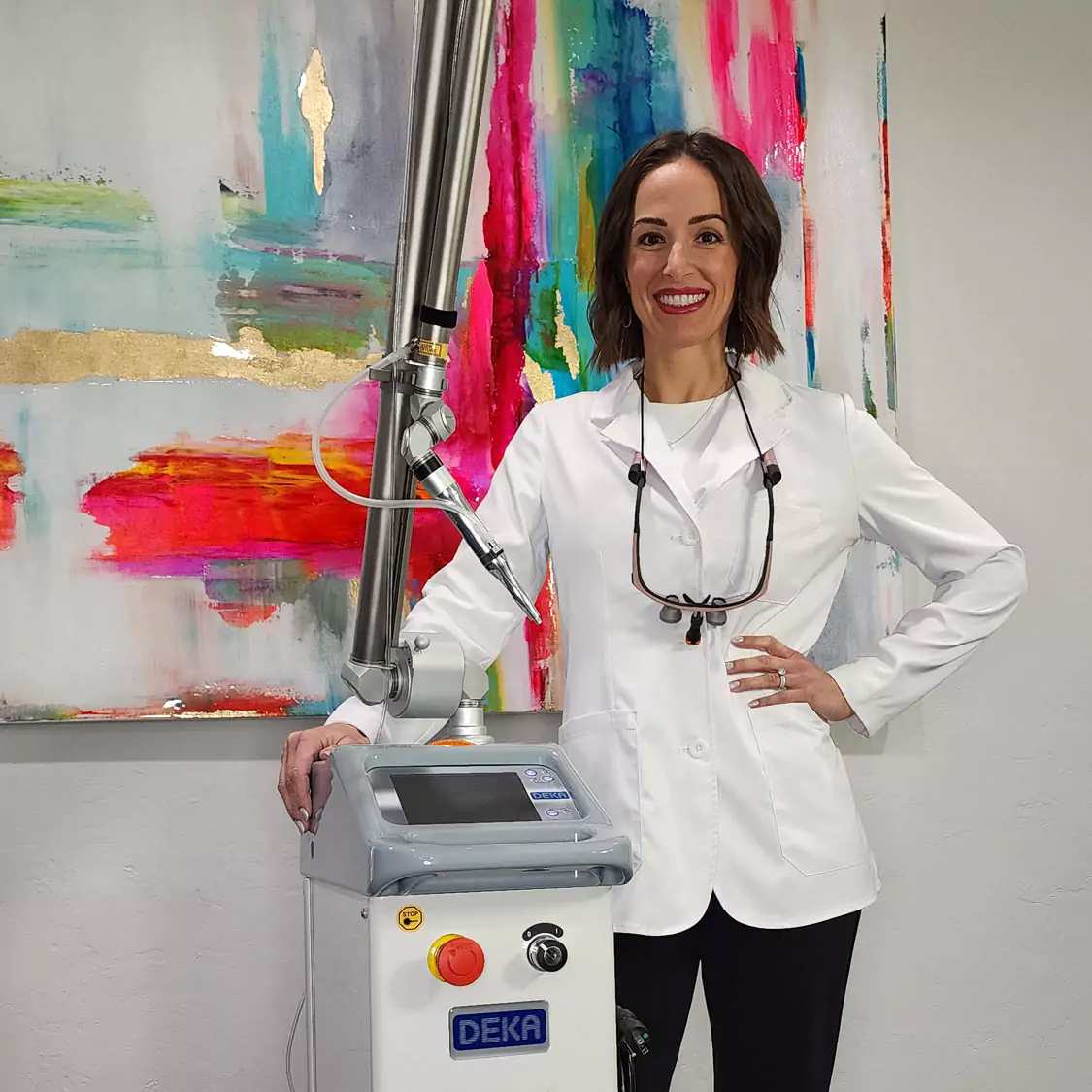 Dr. Traci Leon with DEKA laser technology